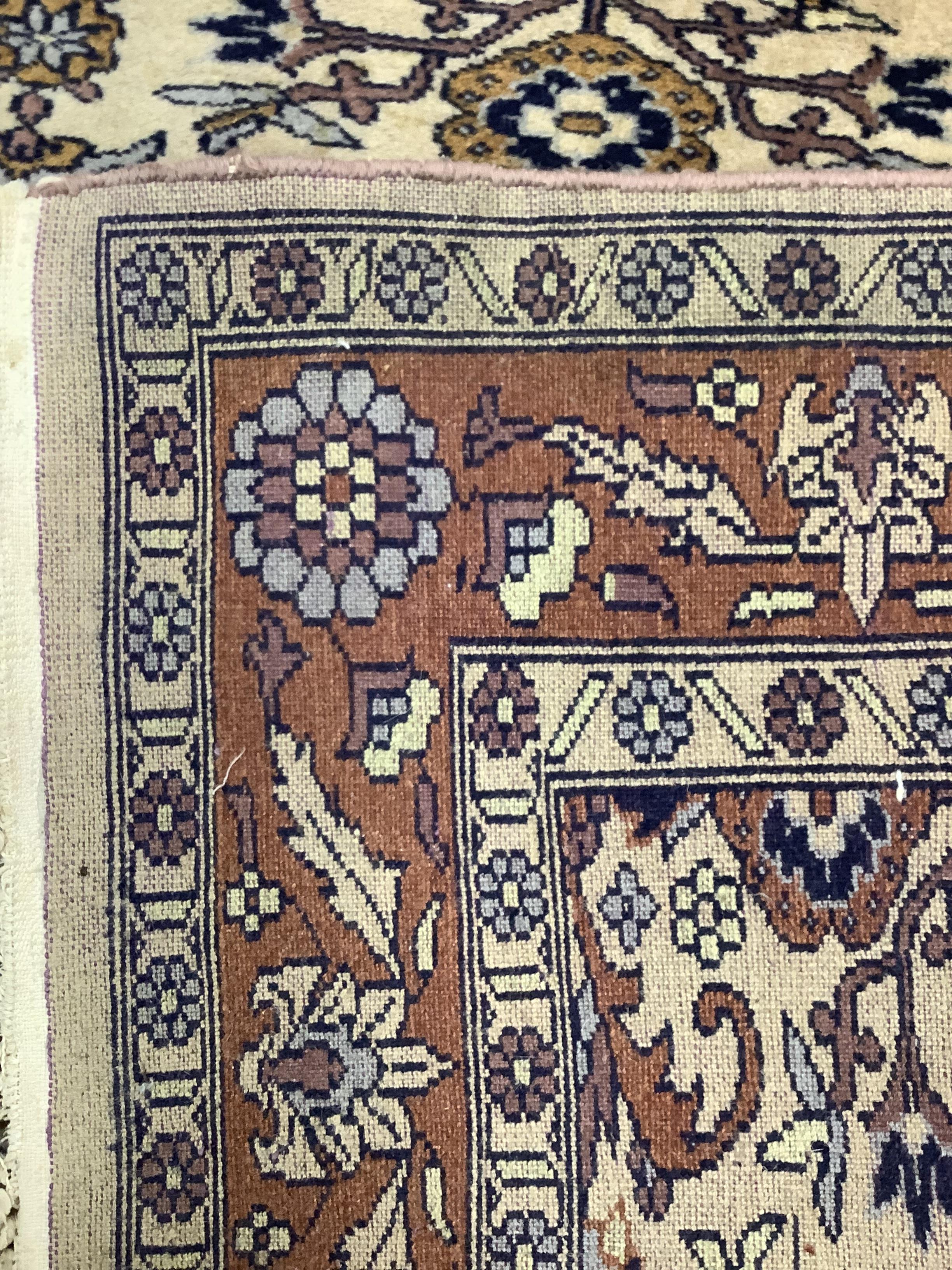 A North West Persian ivory ground rug, 182 x 124cm